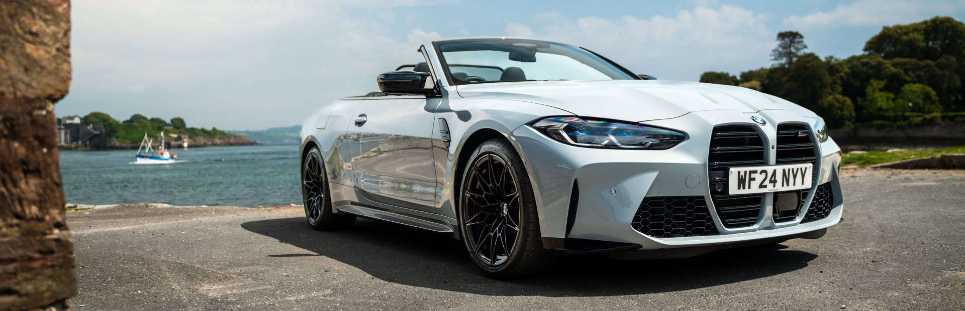 BMW M4 Convertible parked near the sea.